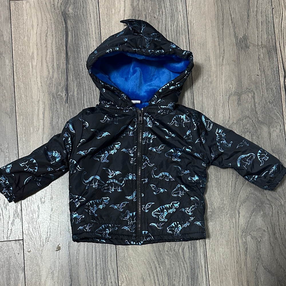 Kids Dinosaur Print Raincoat with soft blue fuzzy lining. NWOT. 12 months.